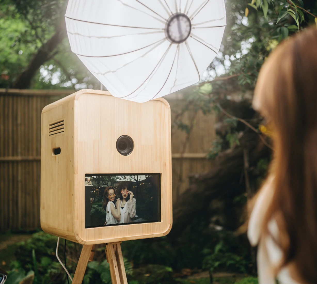 Photo booth with umbrella light outdoors