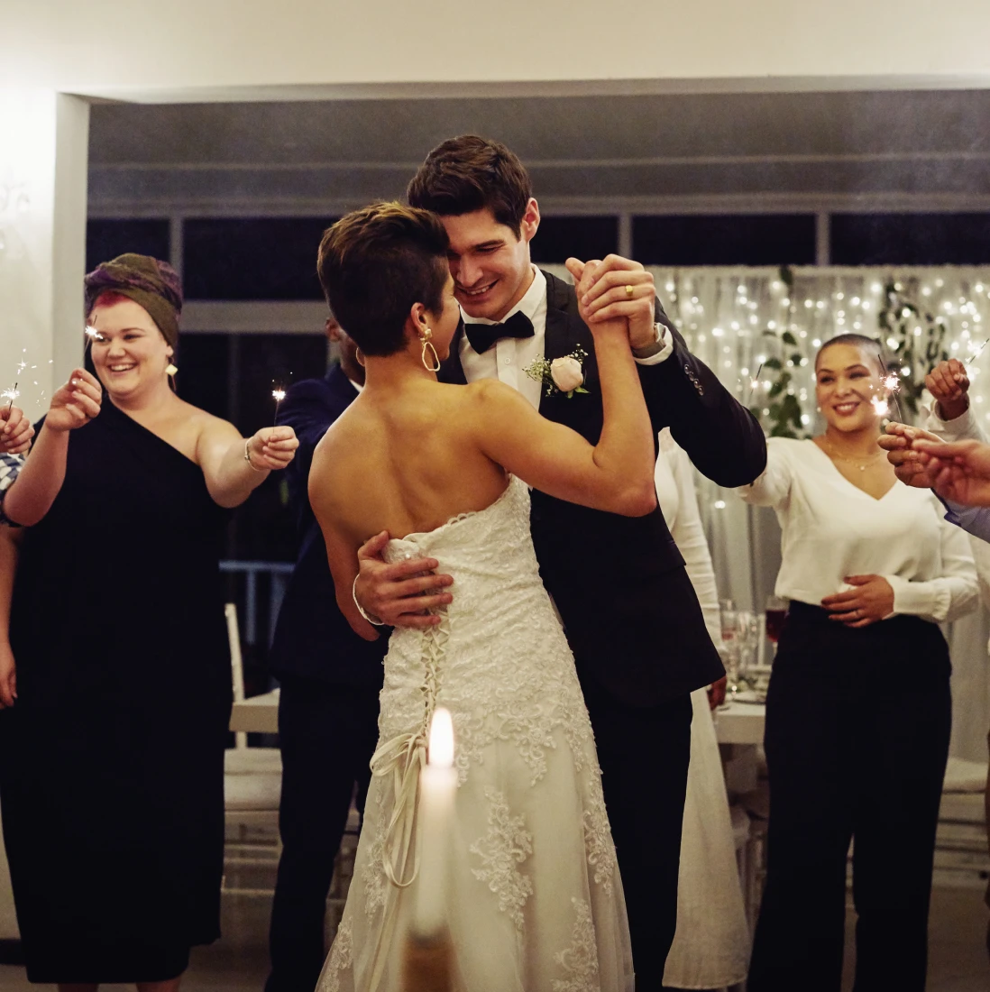 Wedding couple surrounded by guests